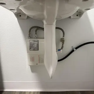 InstaFlow under-sink water heater with supply lines