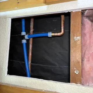 Cold water line reroute with copper and PEX pipes in wall