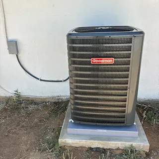 3 ton Goodman air conditioning condenser installed on pad