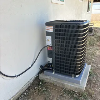 Goodman condenser with disconnect, whip and locking caps