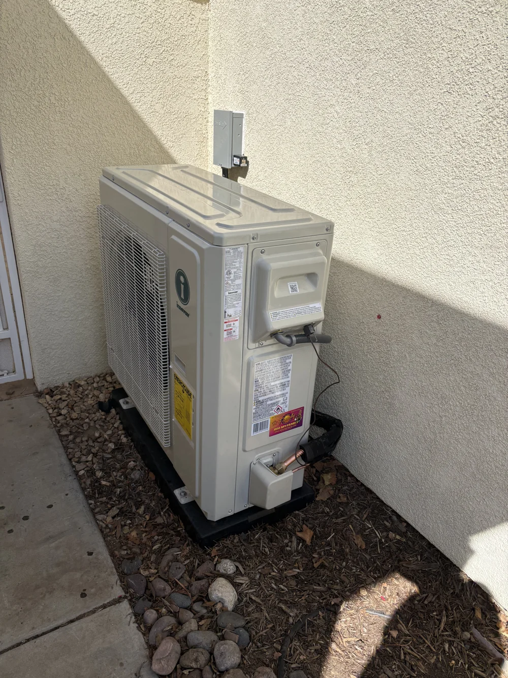 Side view of the Innovair outdoor unit and refrigerant connections