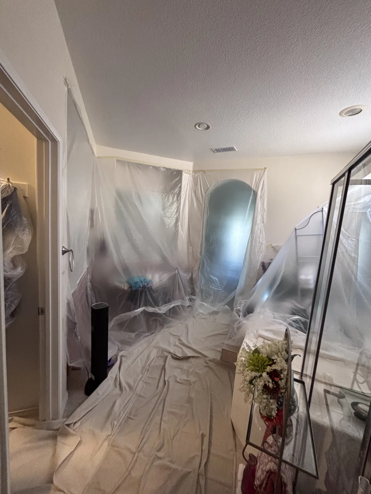 Room furnishings and flooring covered for protection during repiping